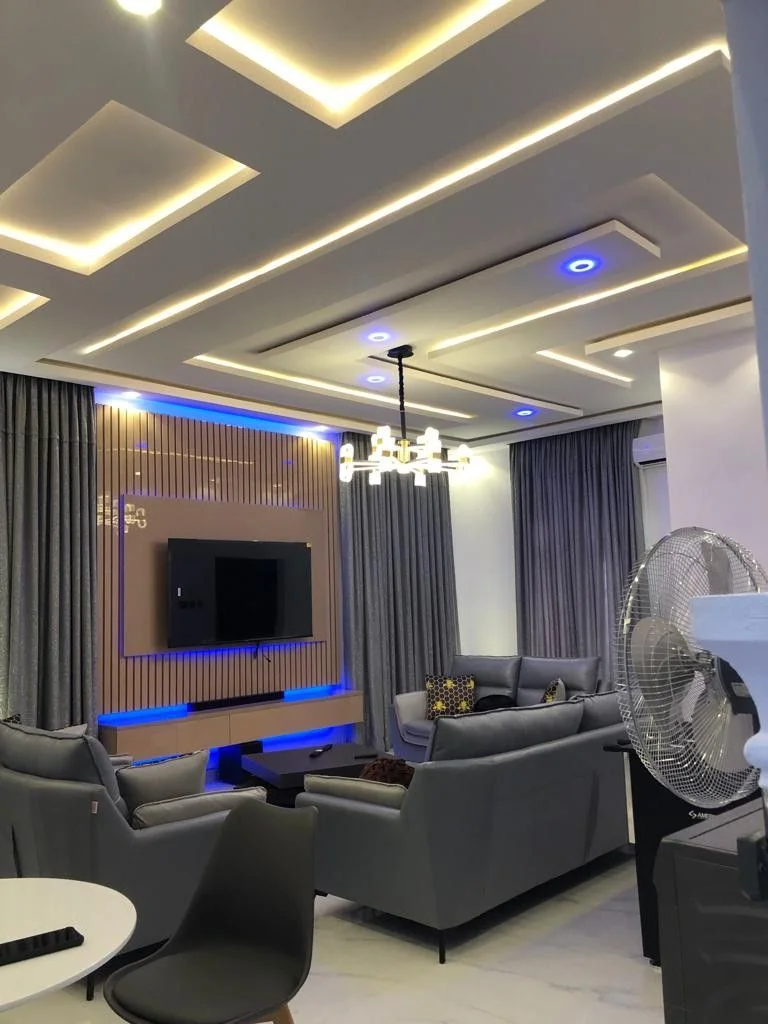 Living room false ceiling with blue LED accent strip lighting Dubai