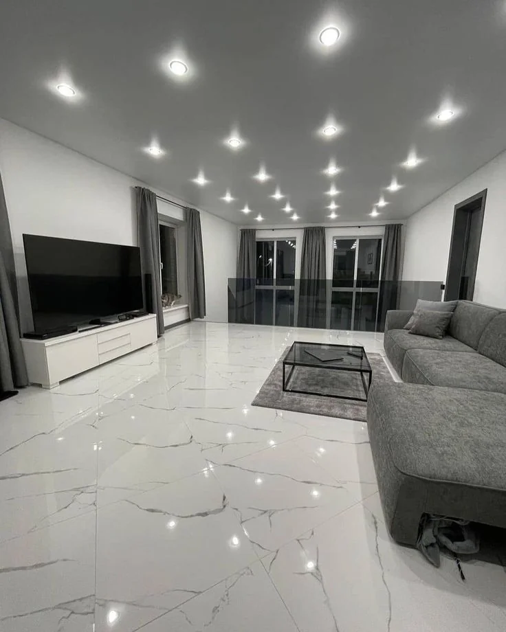 Minimalist white marble living room with spotlights