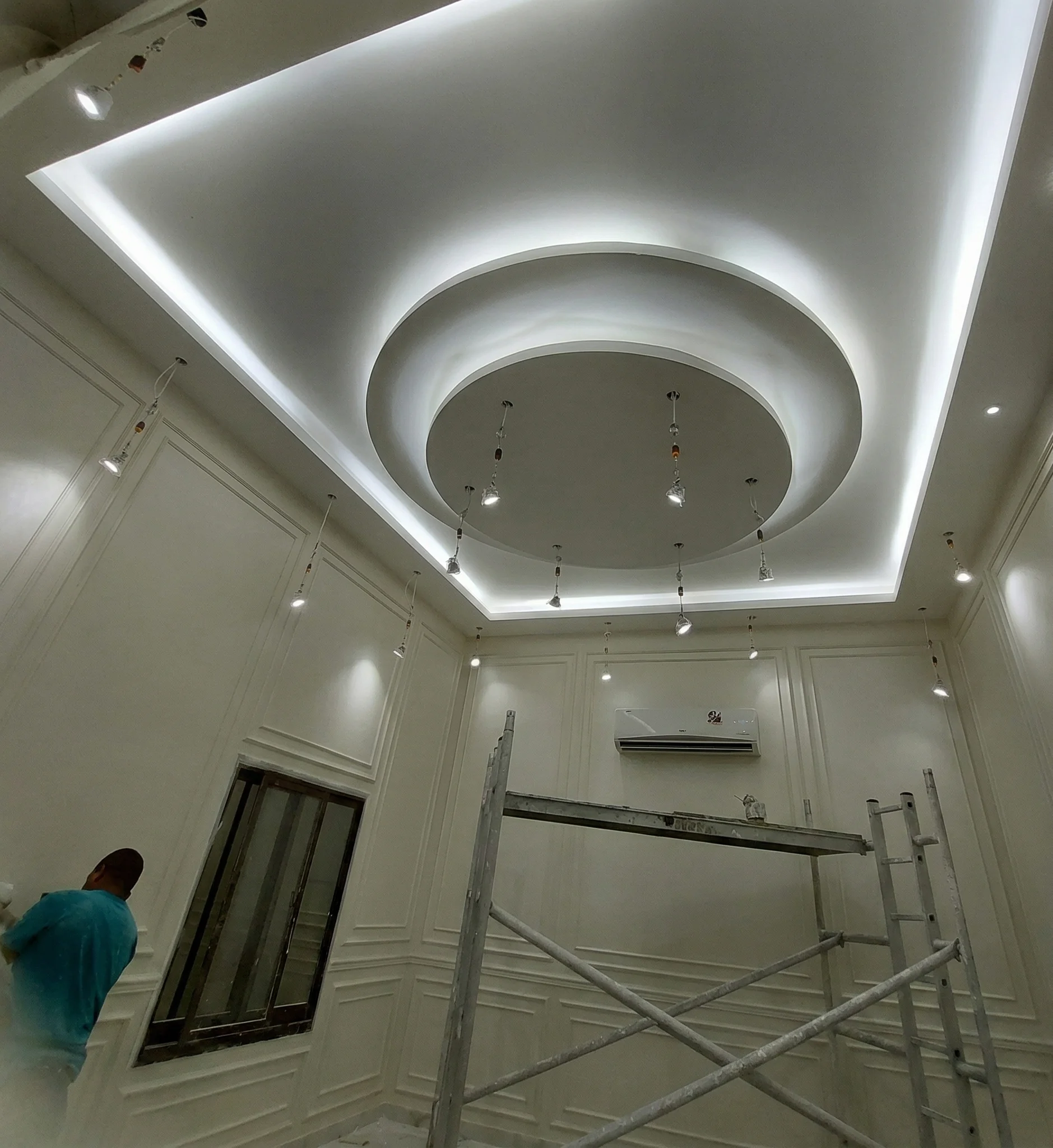 Custom circular gypsum false ceiling with cove LED lighting installation Dubai villa